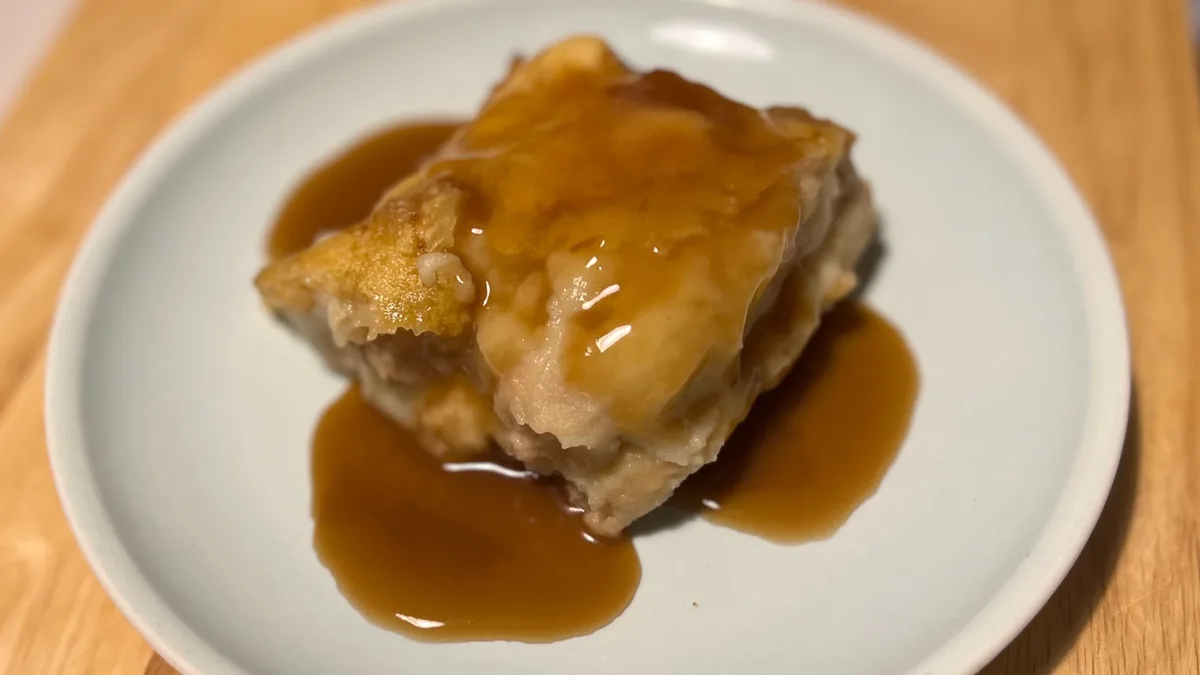 A slice of Sausage and Mash Lasagna on a plate