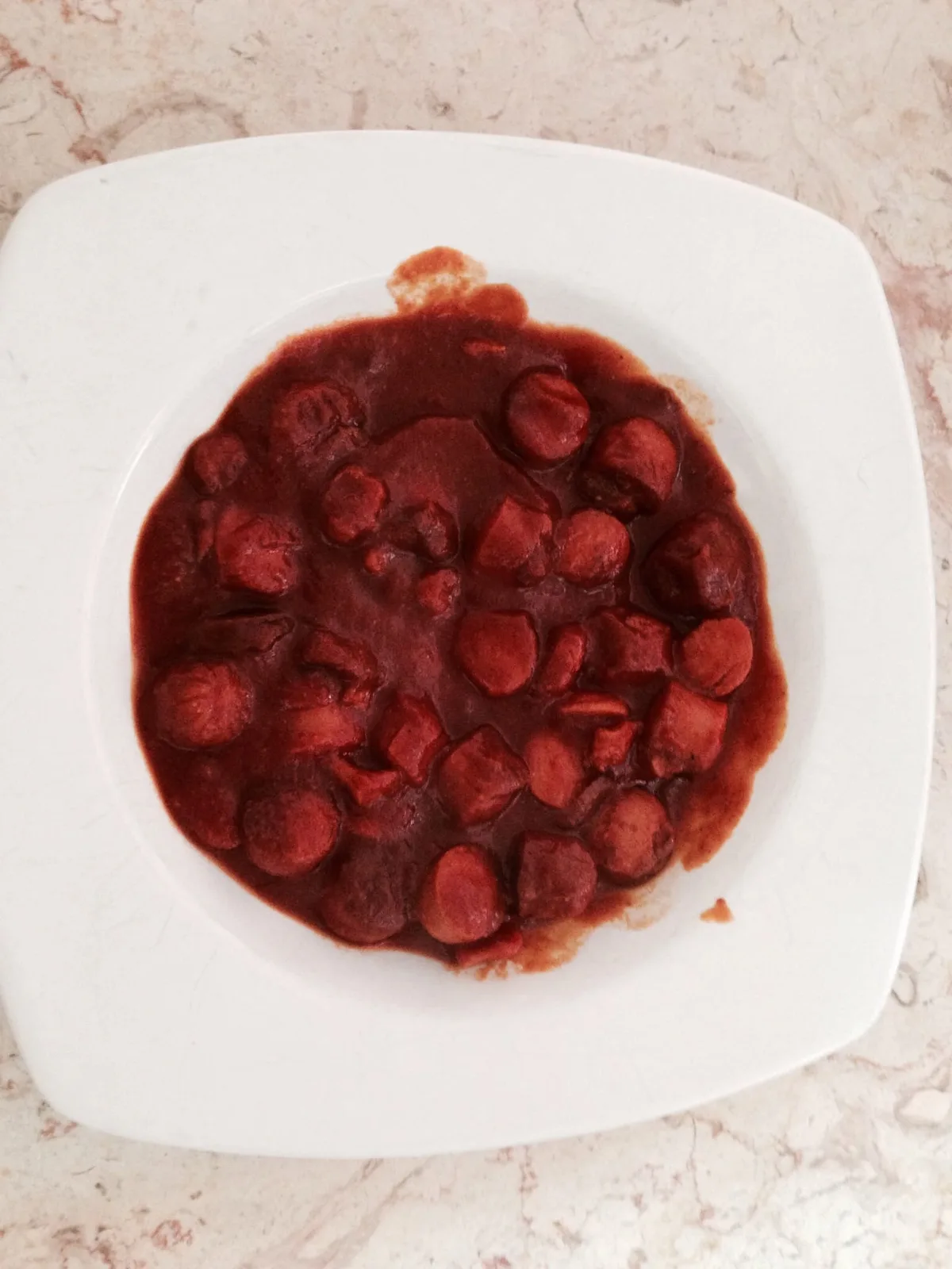 Hot dog with tomato sauce